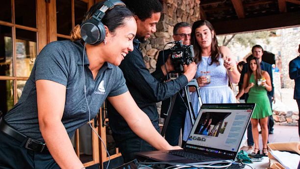 a person with headphones on using a laptop