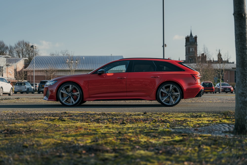 a red car parked on the side of a road