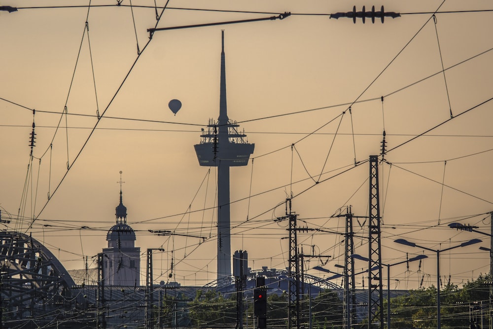 a power line with a tower in the background