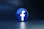 a blue logo with a white cross