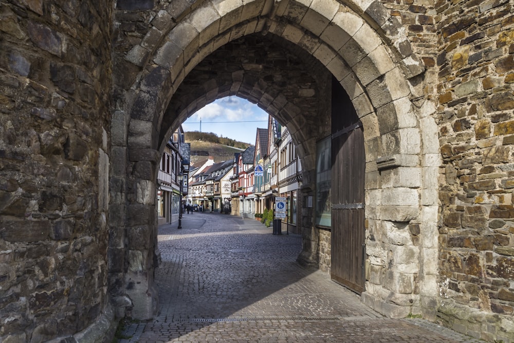 a stone street with buildings on either side of it