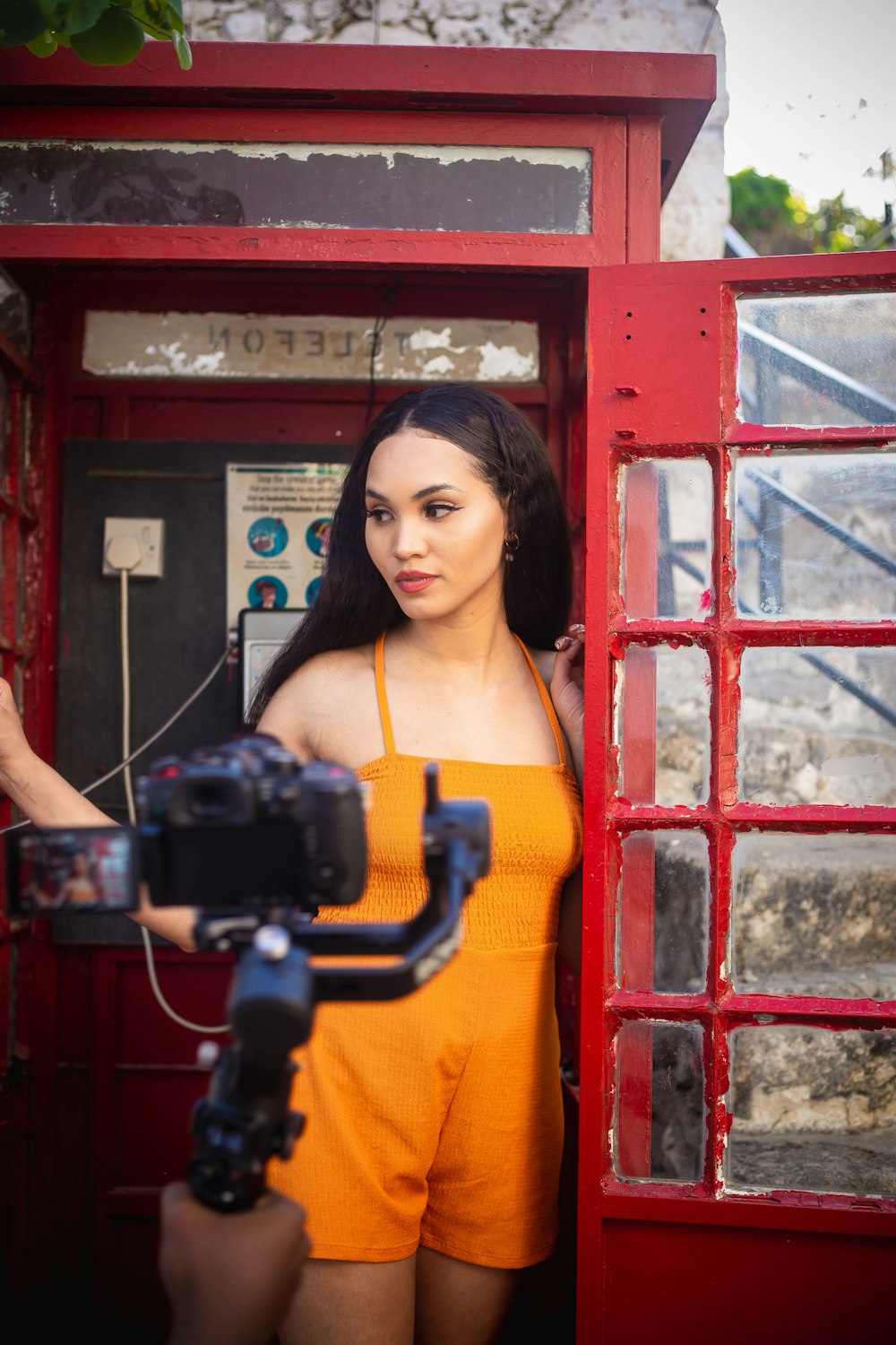 a woman holding a camera