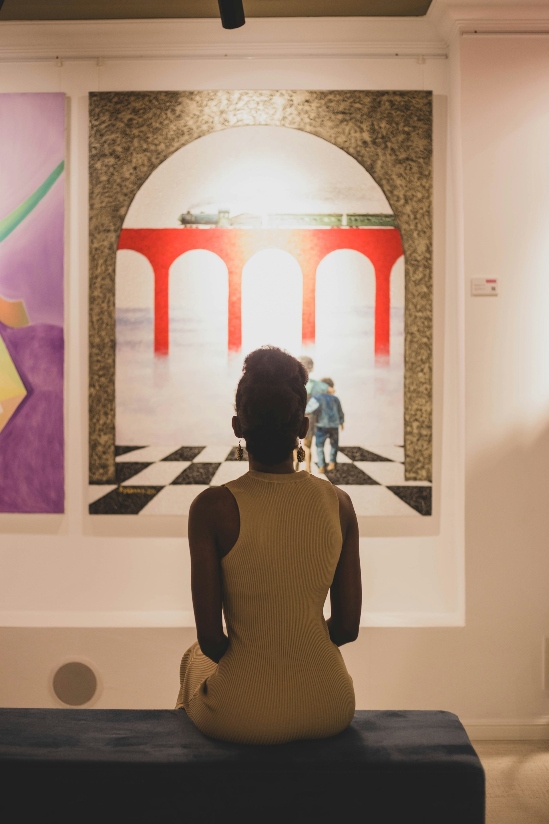 a person looking at a painting