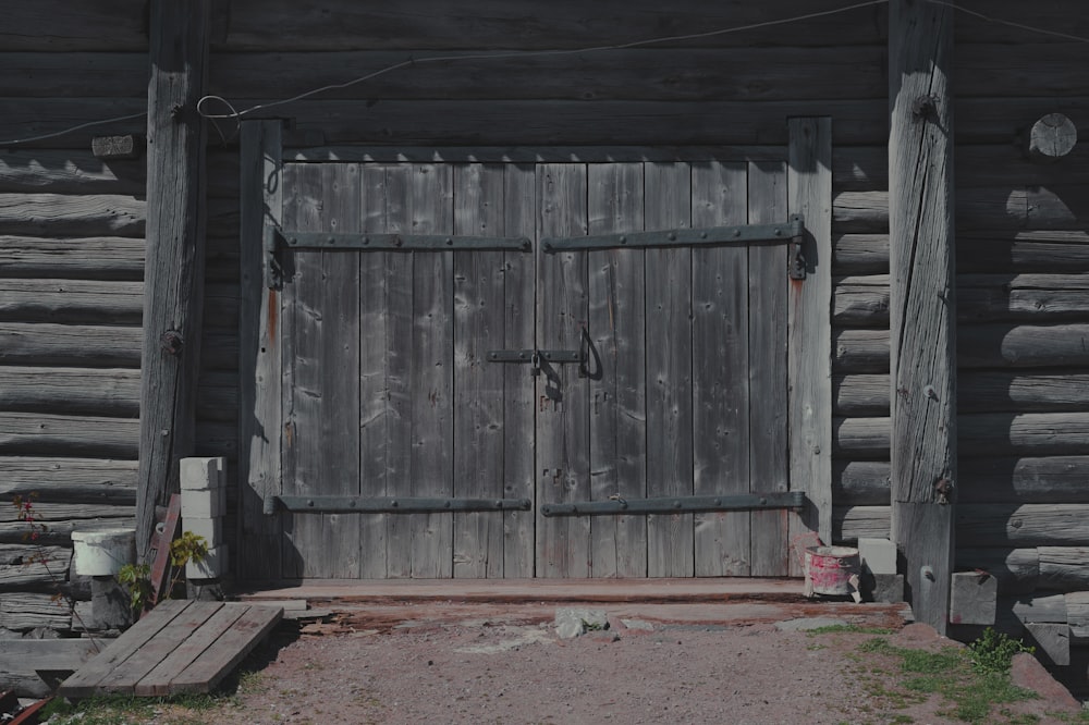 a wooden gate in a barn