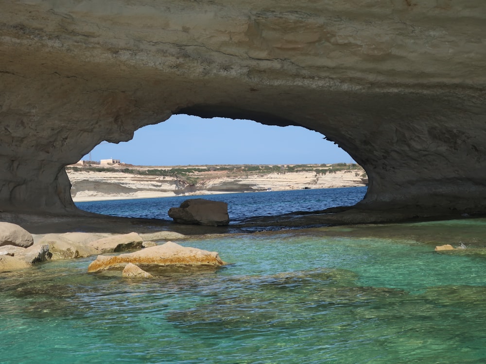 a cave with a body of water