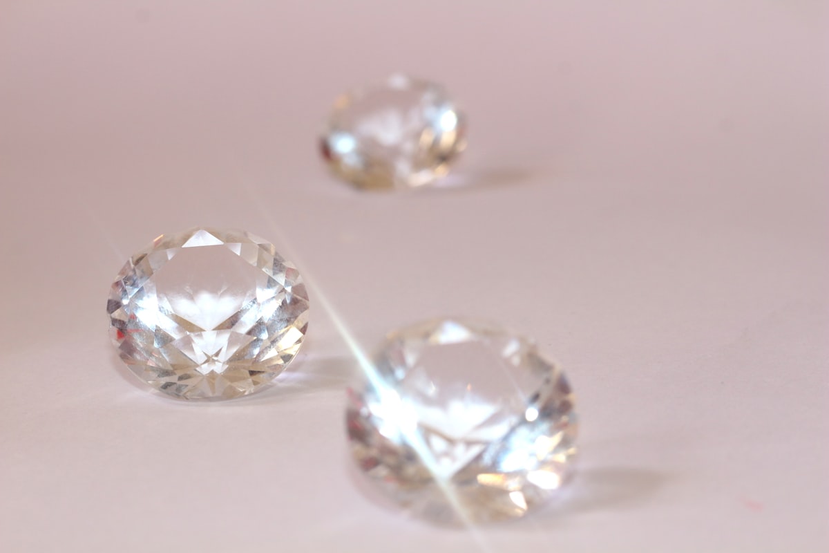 Loose diamonds side by side illustrating a natural and lab-grown comparison