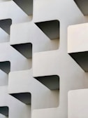 Minimalist building facade showcasing elegant geometric shapes.