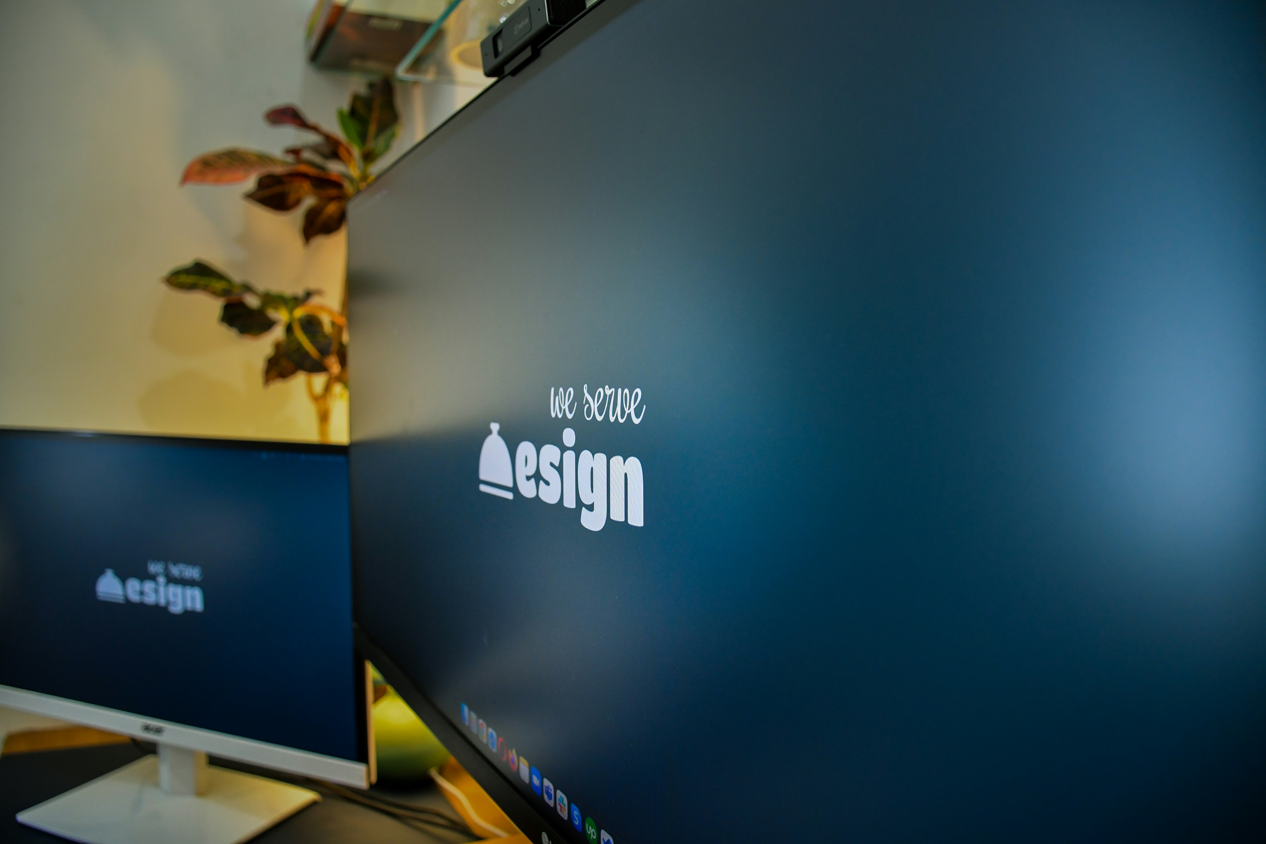 We serve design logo on a computer screen 