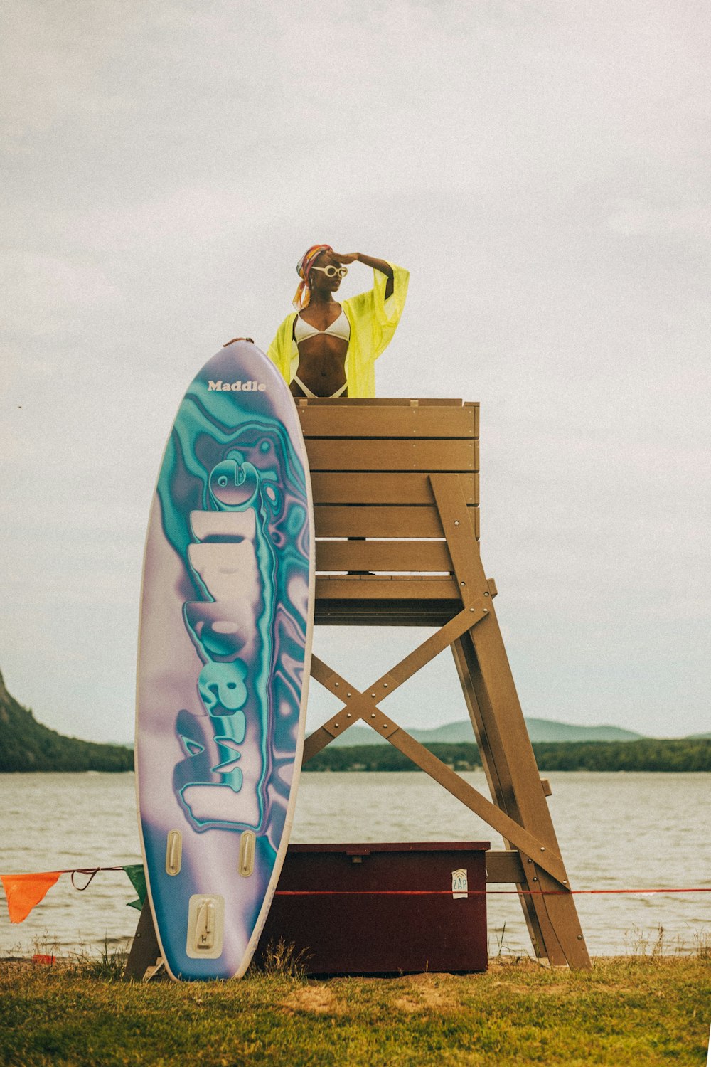 a person stands on a surfboard