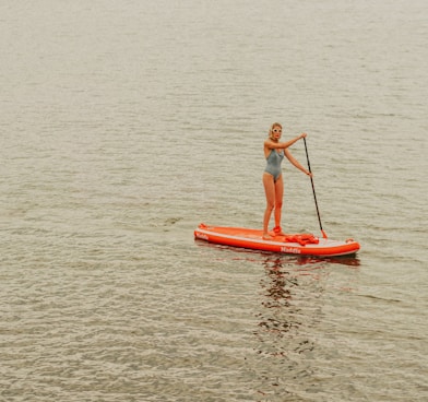 a man paddle boarding
