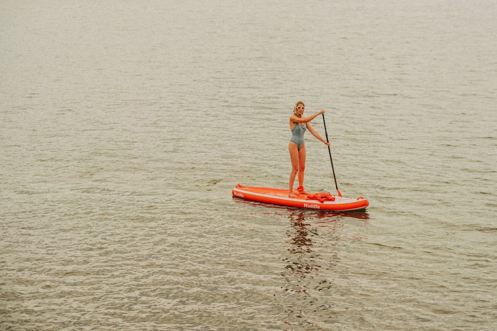 a man paddle boarding