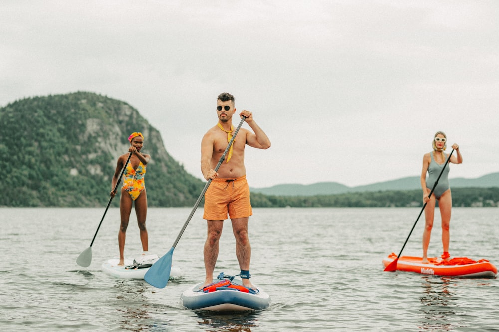 a group of people on paddle boards