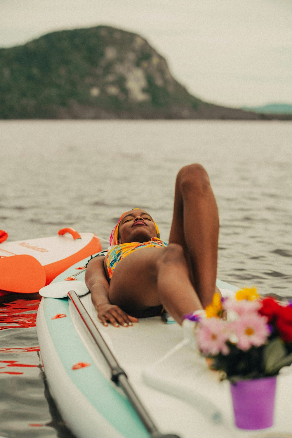 a person lying on a boat