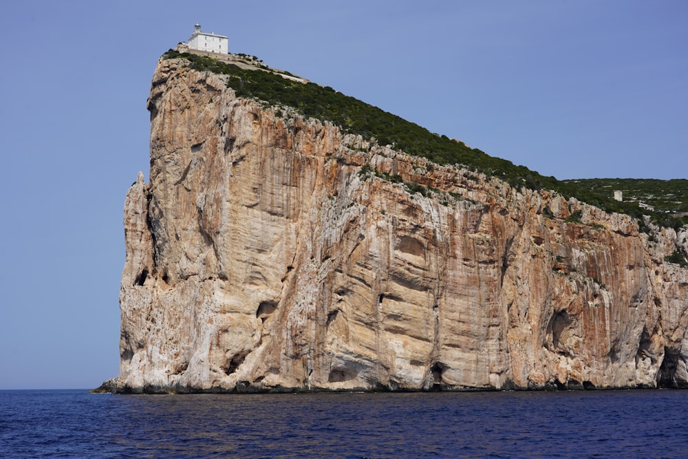 a white building on a cliff