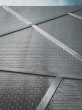Close-up of modern construction materials like steel and tiles arranged neatly.