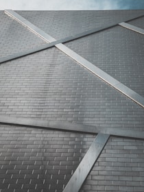 Close-up of modern construction materials like steel and tiles arranged neatly.