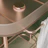 Sleek wooden bar cart adorned with glassware and fresh herbs, set on a cozy porch.