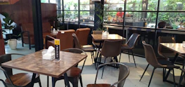 Before-and-after shot of a boutique café renovation highlighting refined transformation.