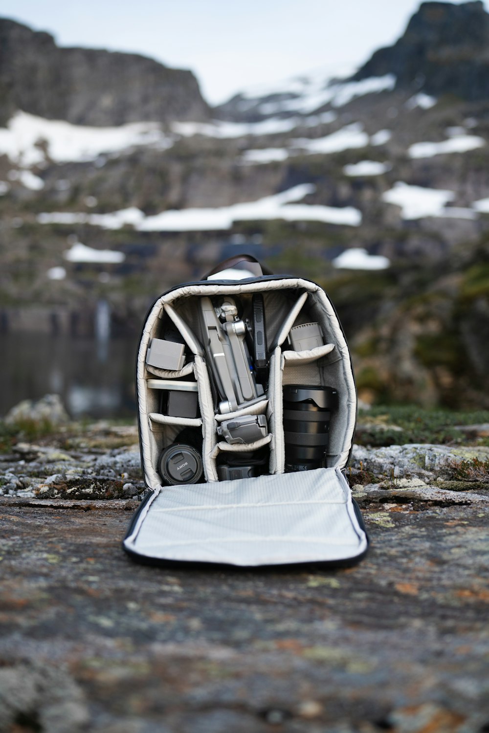 a small stroller on a rocky beach