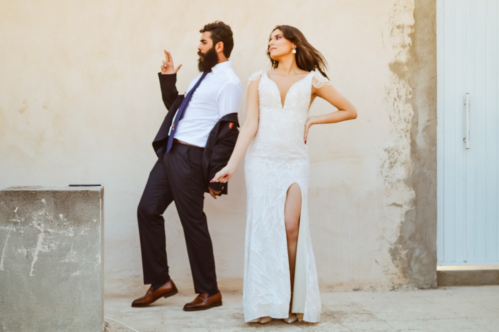 a man and woman in formal wear