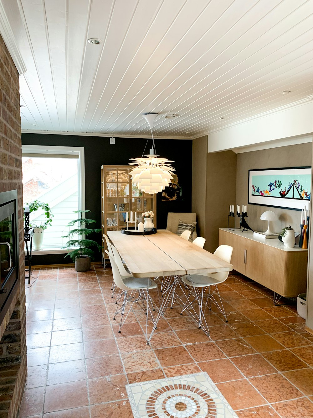 a dining room with a chandelier and a table