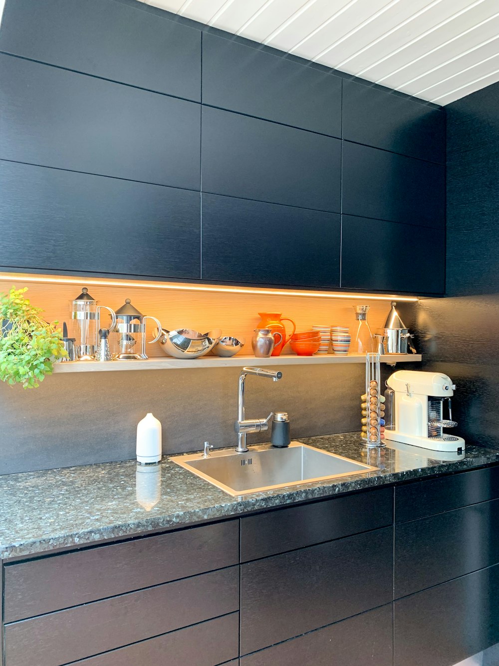 a kitchen with a sink and a counter top