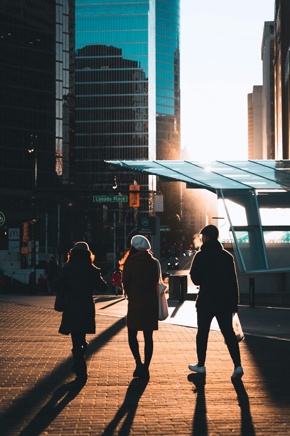 people walking on a sidewalk