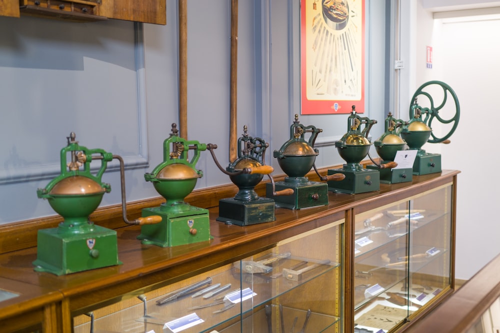 a glass case with various vases