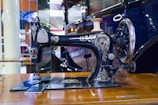 A restored sewing machine with shiny metal parts and a polished surface.