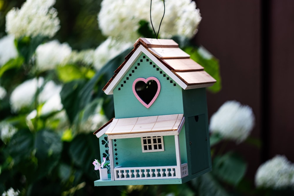 a small house with a tree in the background