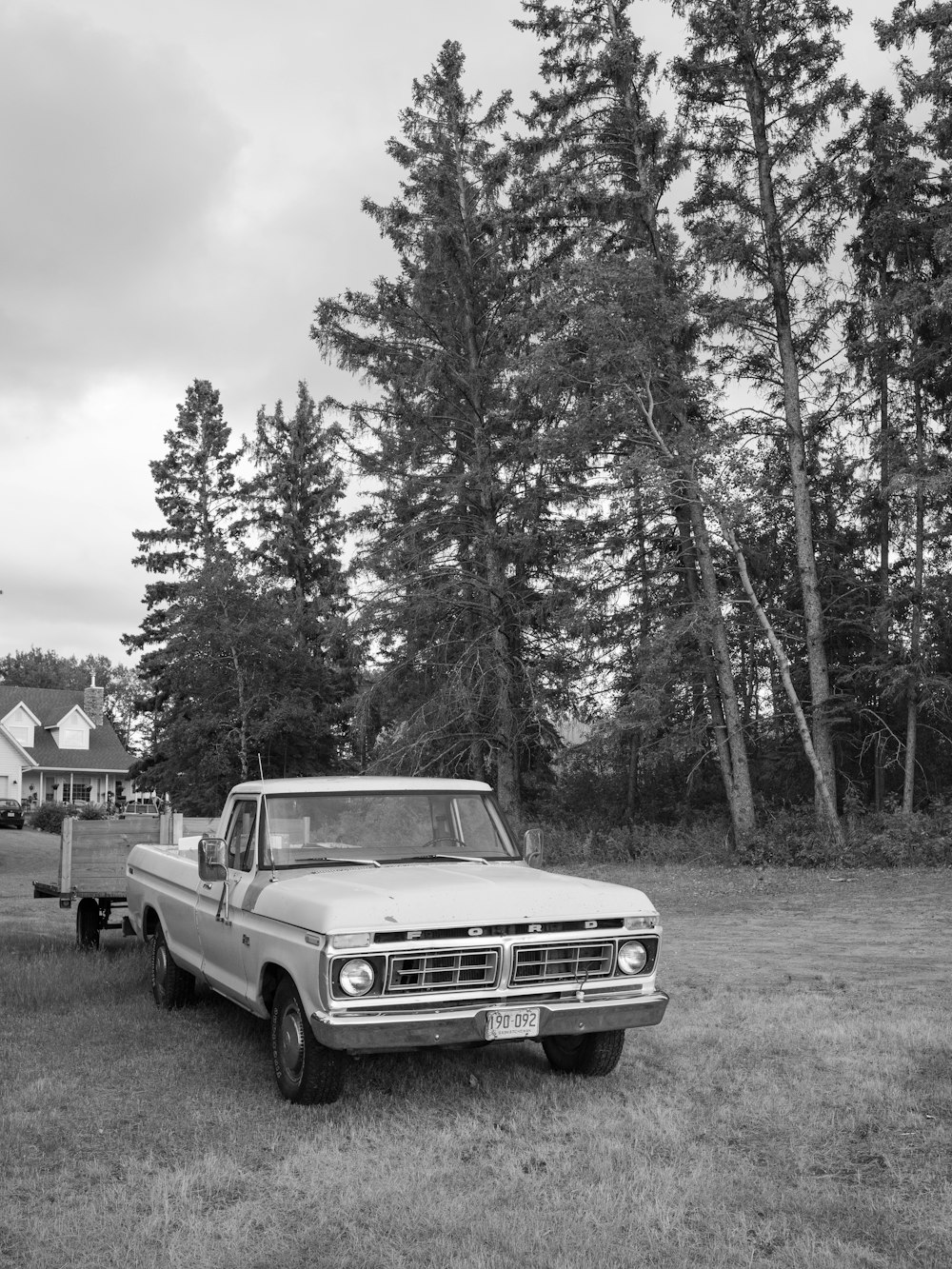 a white truck parked in a field