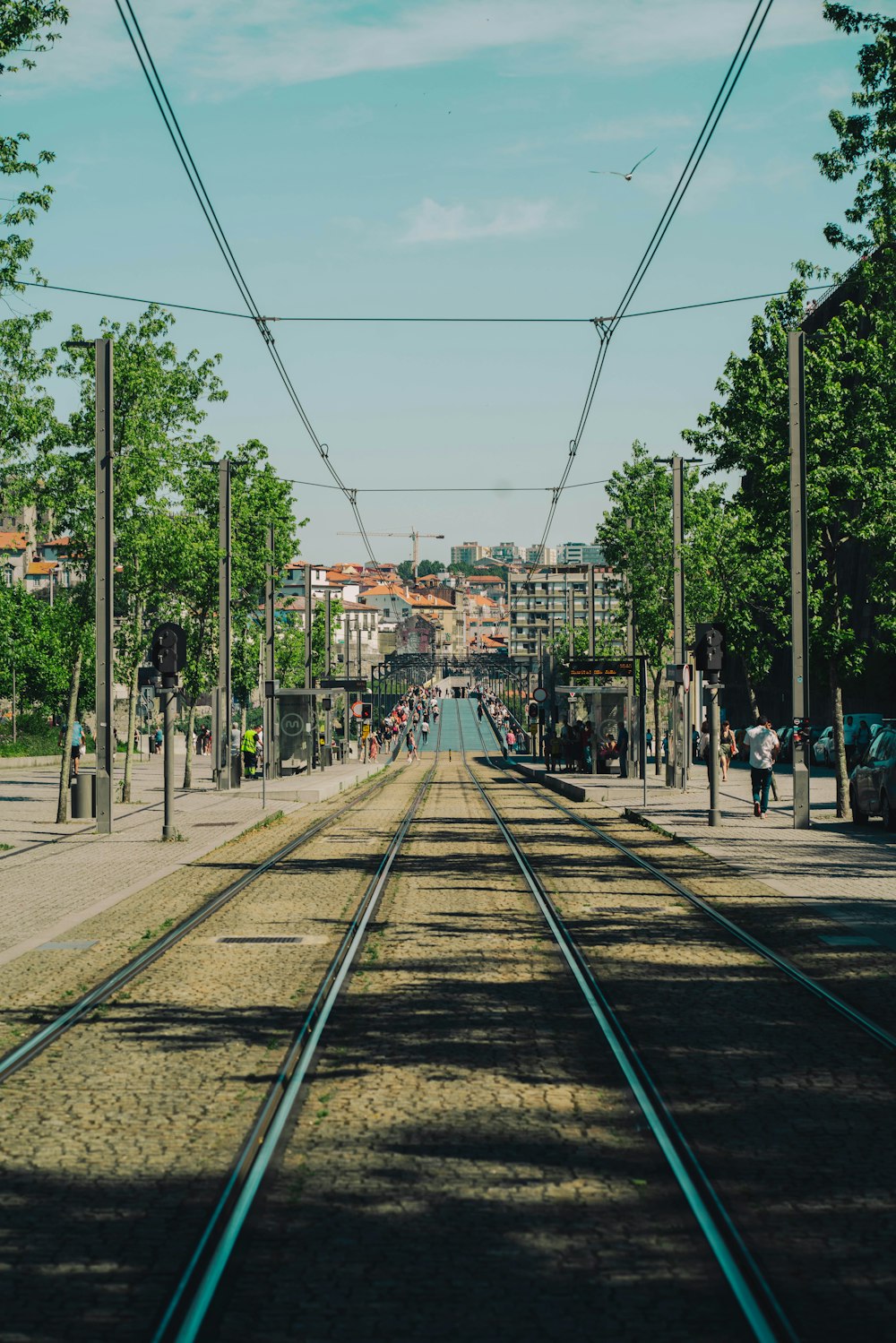 train tracks with buildings in the background