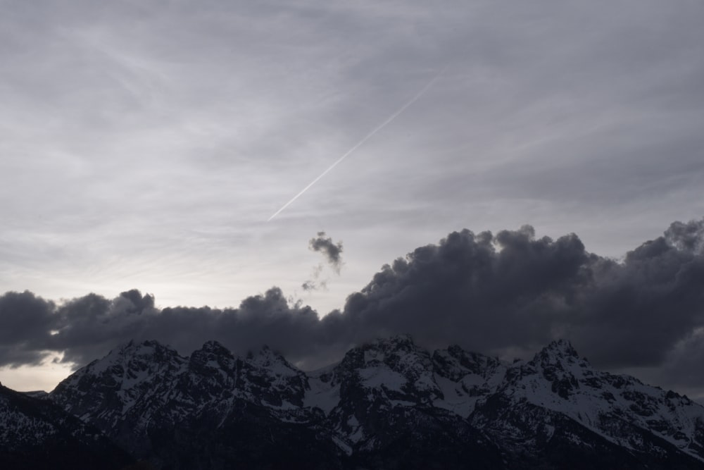 a mountain with clouds