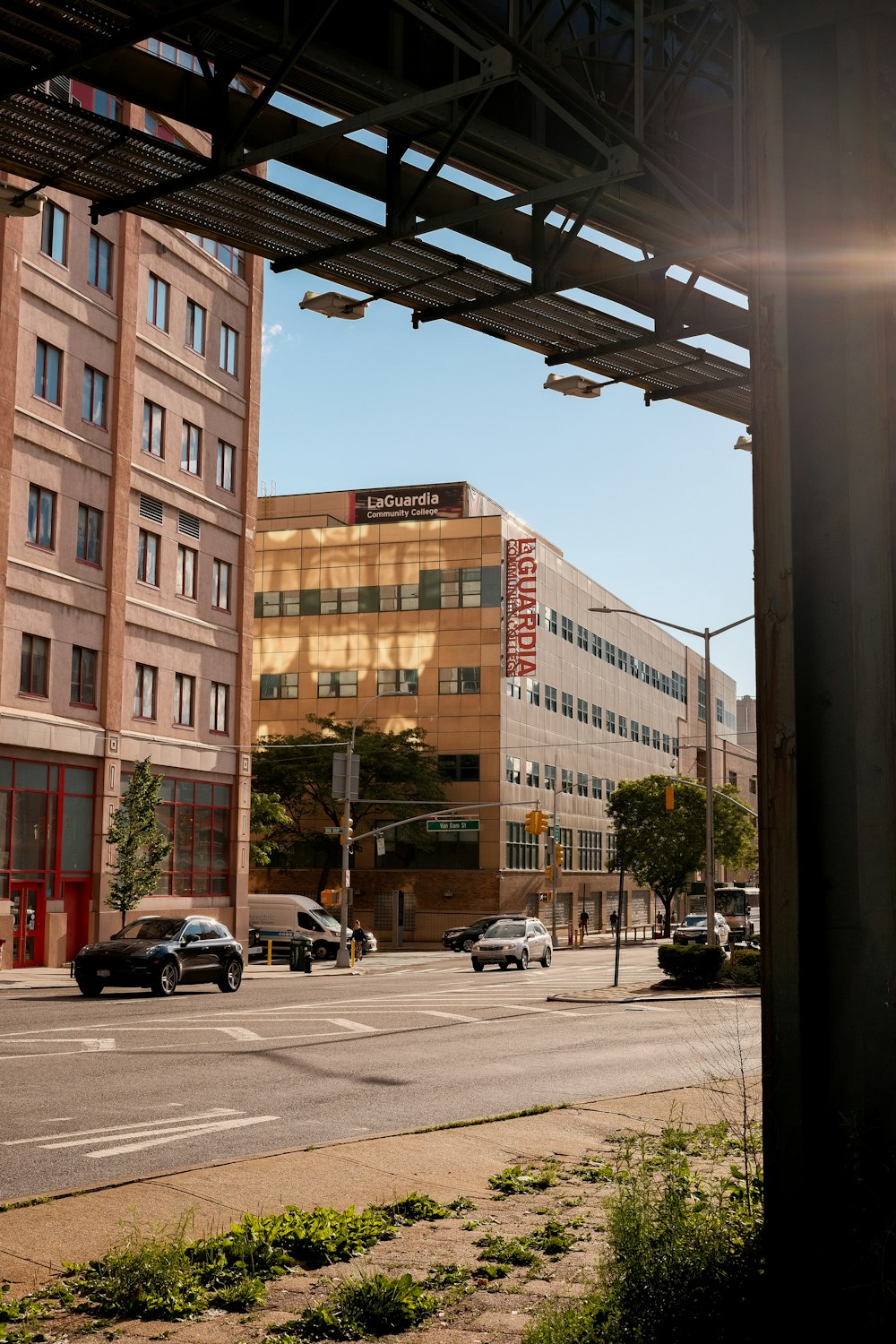 a street with cars and buildings on the side