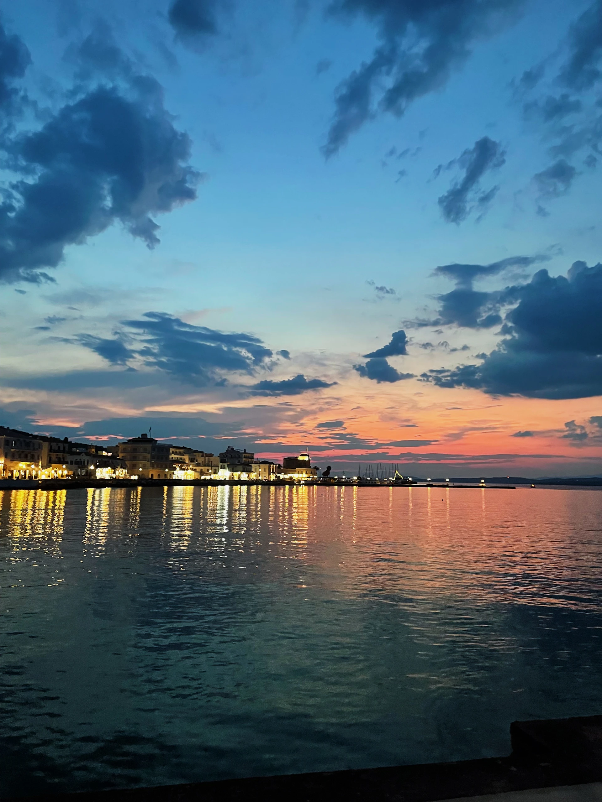 woman wearing yellow long-sleeved dress under white clouds and blue sky during daytime