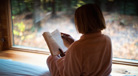 a person sitting in front of a window