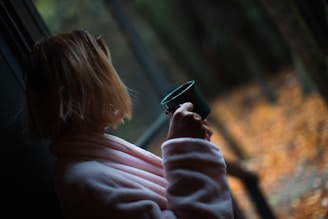 a woman looking at her cell phone
