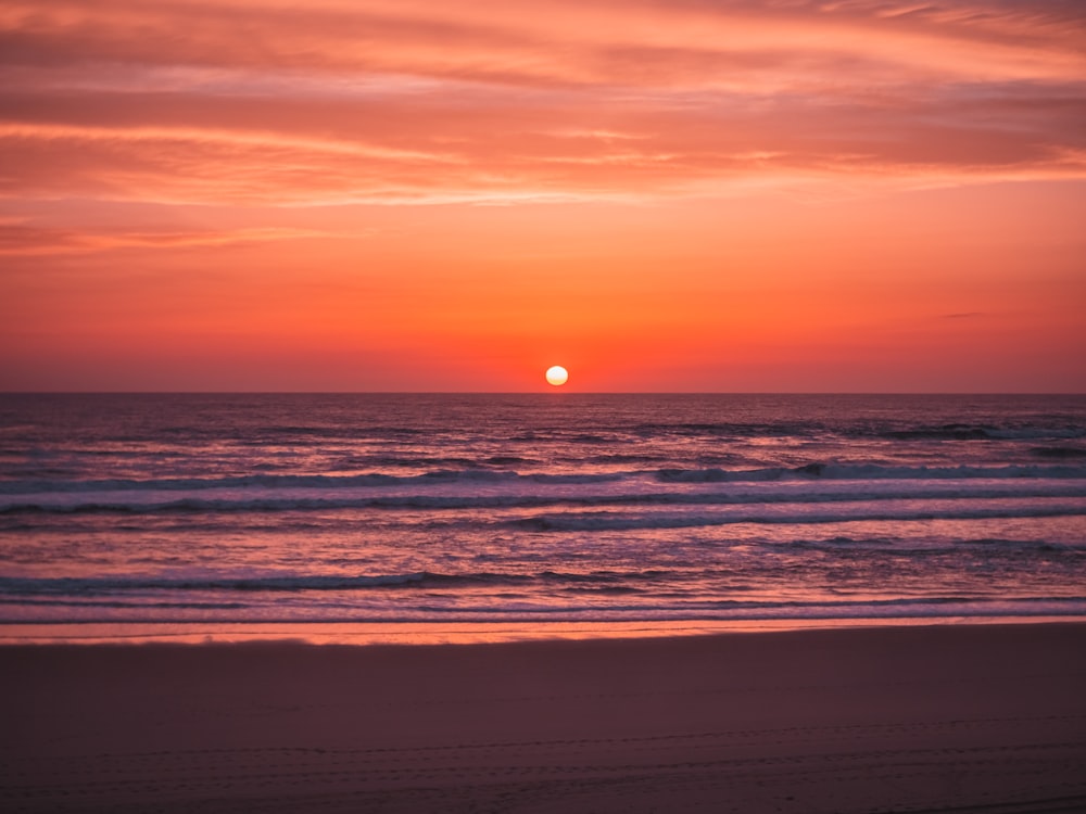 a sunset over the ocean