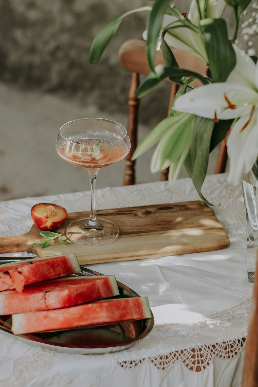 a glass of wine next to a plate of food