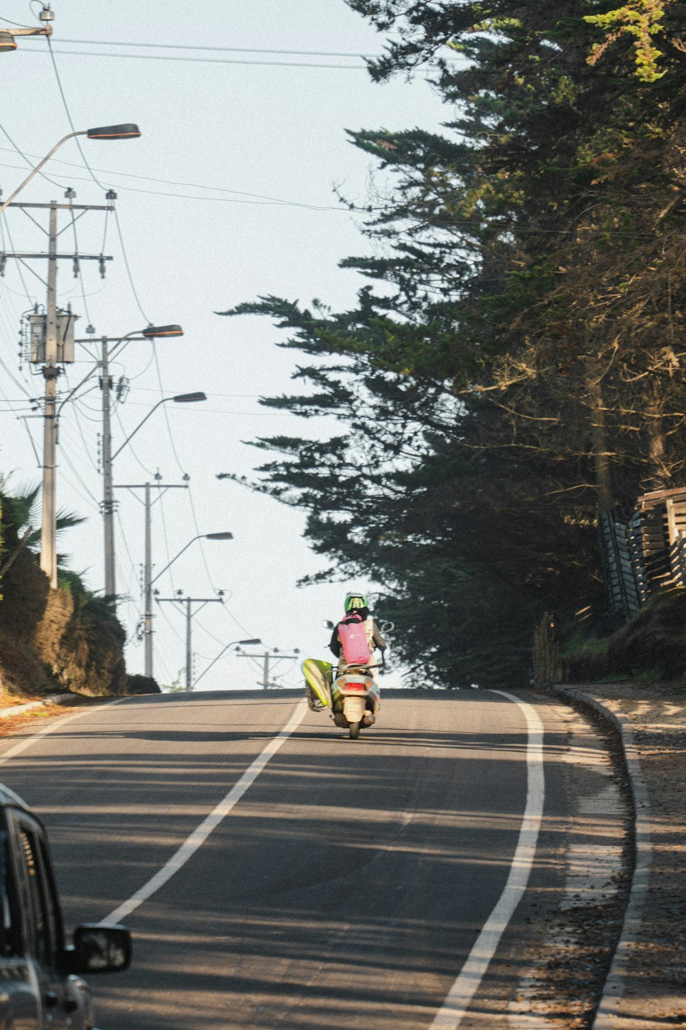 a person riding a motorcycle on a road