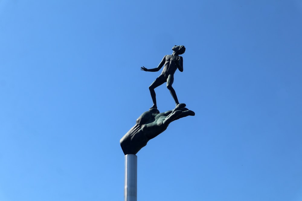 a statue of a person riding a horse