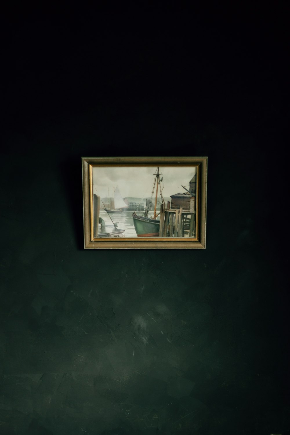 a framed picture of a boat