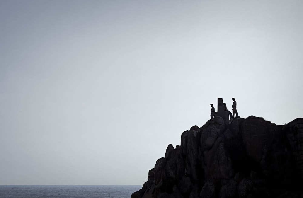 a group of people on a rocky cliff