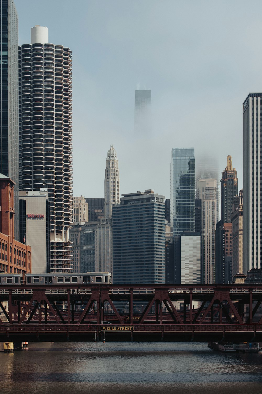 a bridge over a river in a city