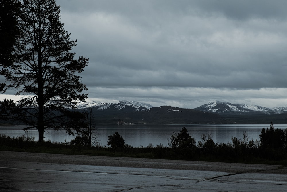 a lake with mountains in the background