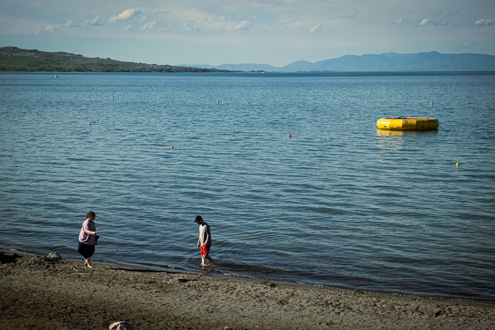 people standing on a beach