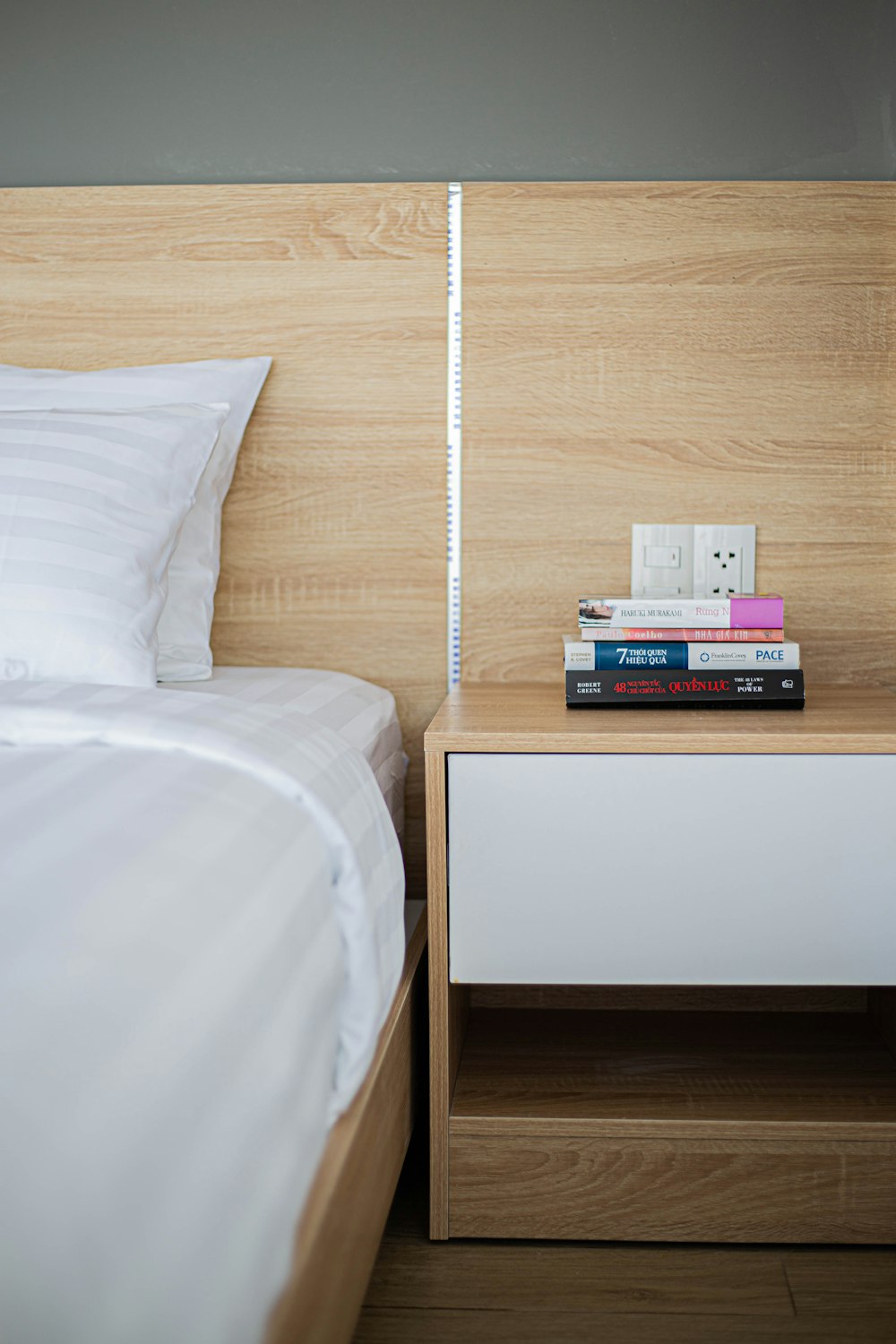 a bed with books on it