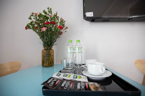 Fresh flowers and welcome basket arranged on the suite’s coffee table.
