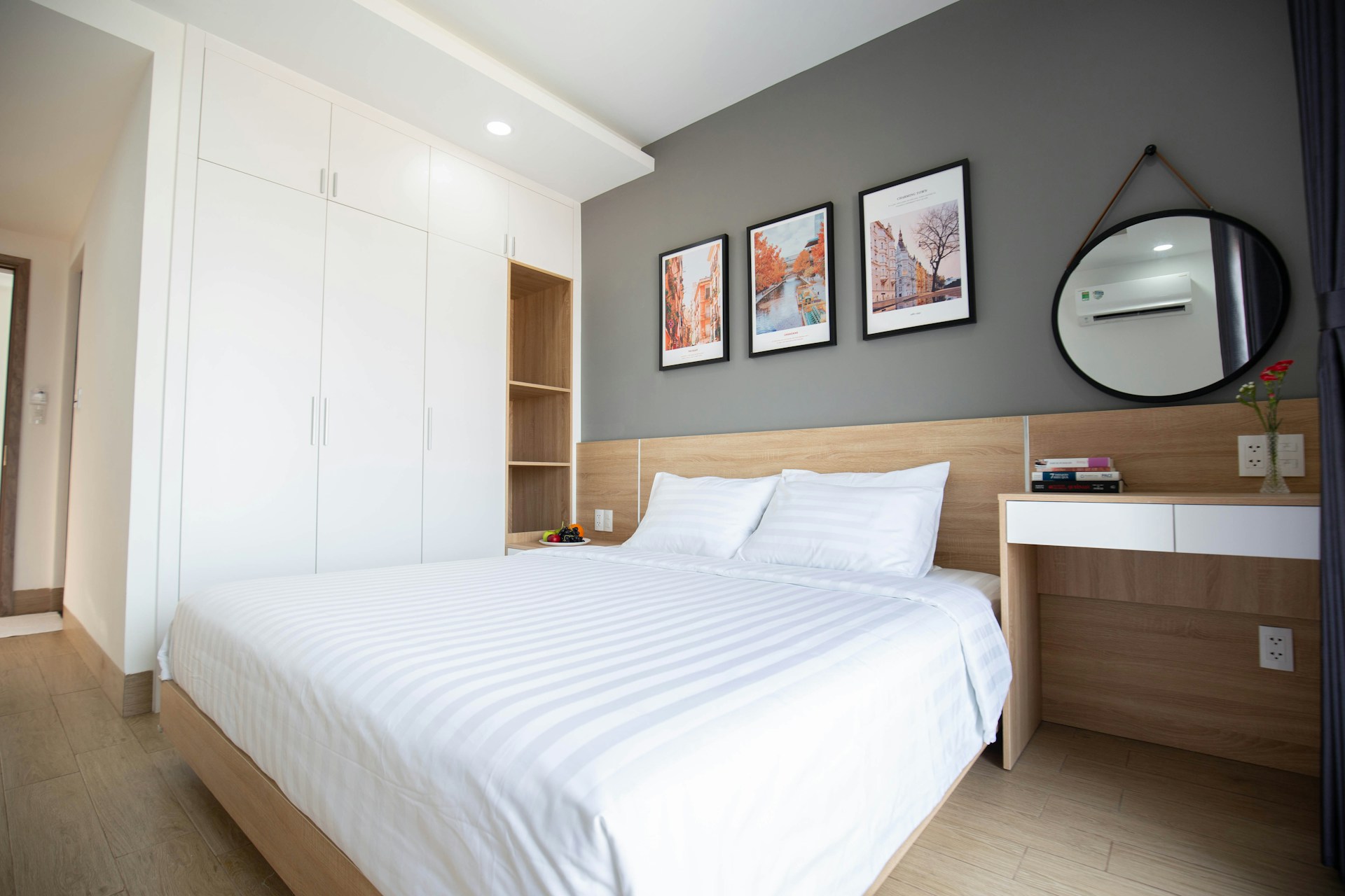 a bedroom with a large mirror