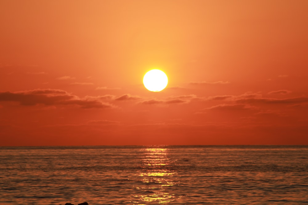 a sunset over a body of water